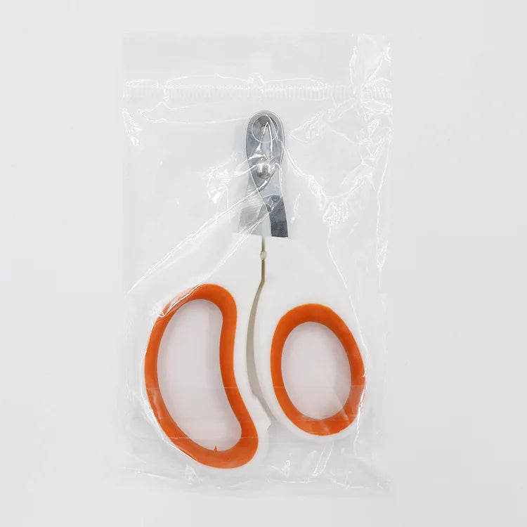 Coupe-griffes de précision pour chat sous emballage scellé, modèle blanc et orange avec lame perforée anti-blessure en acier inoxydable, prêt pour un usage hygiénique.