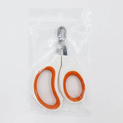 Coupe-griffes de précision pour chat sous emballage scellé, modèle blanc et orange avec lame perforée anti-blessure en acier inoxydable, prêt pour un usage hygiénique.