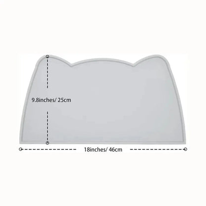 Schéma technique détaillé présentant les dimensions exactes du tapis gamelles chat de la boutique Les Trésors d'Owka. L'image affiche un tapis chat gris en silicone avec une largeur de 46 cm (18 pouces) et une hauteur de 25 cm (9,8 pouces). Ce tapis gamelles offre une surface de protection généreuse pour vos sols, idéale pour accueillir plusieurs bols ou une fontaine à eau. Sa conception en silicone alimentaire avec bords anti-débordement garantit une hygiène parfaite et une protection durable de vos parque