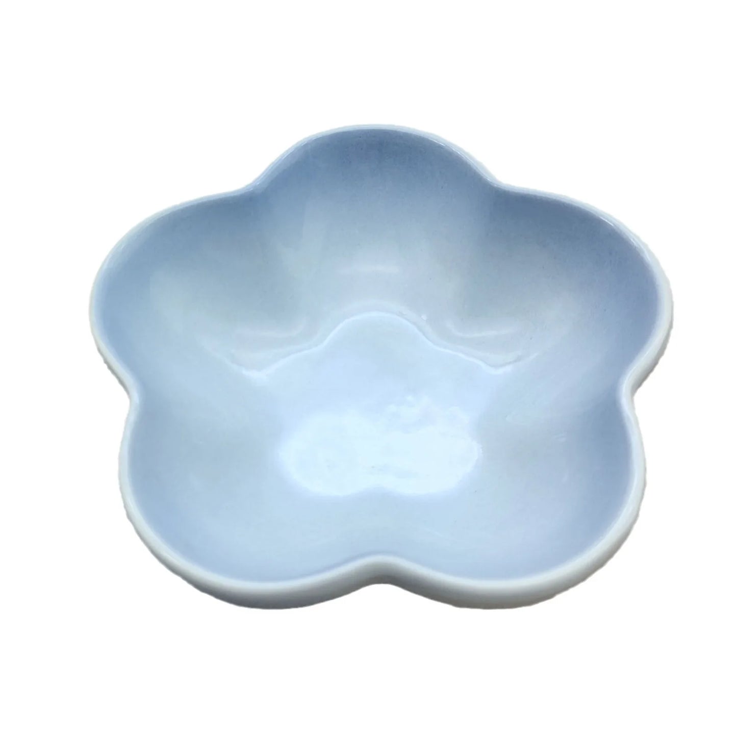 Gamelle pour chat en céramique en forme de fleur avec un dégradé bleu ciel et blanc, design peu profond et évasé pour éviter la fatigue des moustaches.