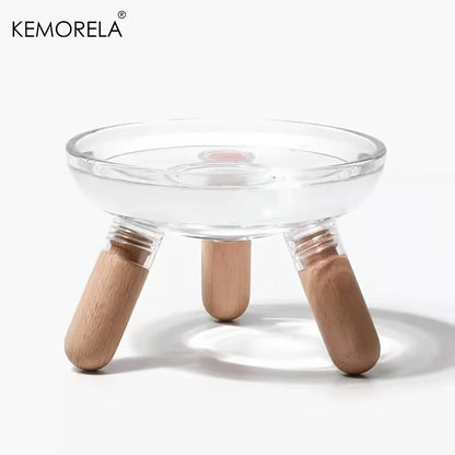 Gamelle surélevée de marque Kemorela en verre transparent épais avec support trépied en bois clair, design moderne et minimaliste pour chat ou petit chien.