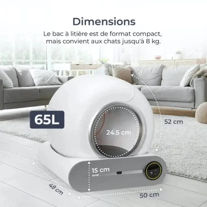 image de la litière autonettoyante avec les dimensions écrites sur chaque cotés dans un salon à coté d'un canapé 