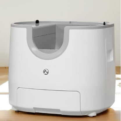 Litière automatique chat autonettoyante ouverte par le haut, coque blanche et grise avec tiroir à déchets à l'avant. Les Trésors d'Owka