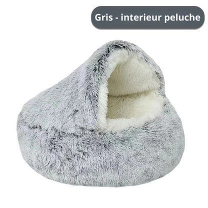 Panier grotte apaisant pour chat en peluche longue bicolore grise et blanche, doté d'un intérieur ultra-moelleux et d'un toit souple protecteur pour un sommeil sécurisant.