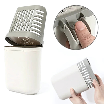 Pelle à litière 2-en-1 avec réservoir montrant le bouton-poussoir ergonomique pour libérer les déjections dans le sac poubelle intégré, vue de l'assemblage du bac amovible blanc et gris.