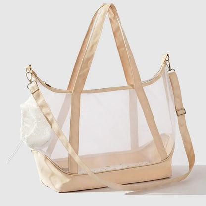 Sac de transport transparent pour chat beige sable type tote bag avec vue panoramique, comprenant de grandes anses, une bandoulière d'épaule réglable et un filet de protection souple.