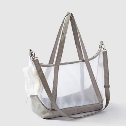 Sac de transport transparent pour chat beige sable type tote bag avec vue panoramique, comprenant de grandes anses, une bandoulière d'épaule réglable et un filet de protection blanc.