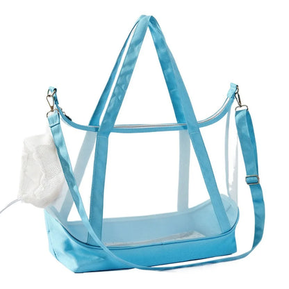 Sac de transport transparent pour chat bleu ciel type tote bag avec vue panoramique, comprenant de grandes anses, une bandoulière d'épaule réglable et un filet de protection souple.