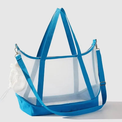 Sac de transport transparent pour chat bleu électrique type tote bag avec vue panoramique, comprenant de grandes anses, une bandoulière d'épaule réglable et un filet de protection blanc.