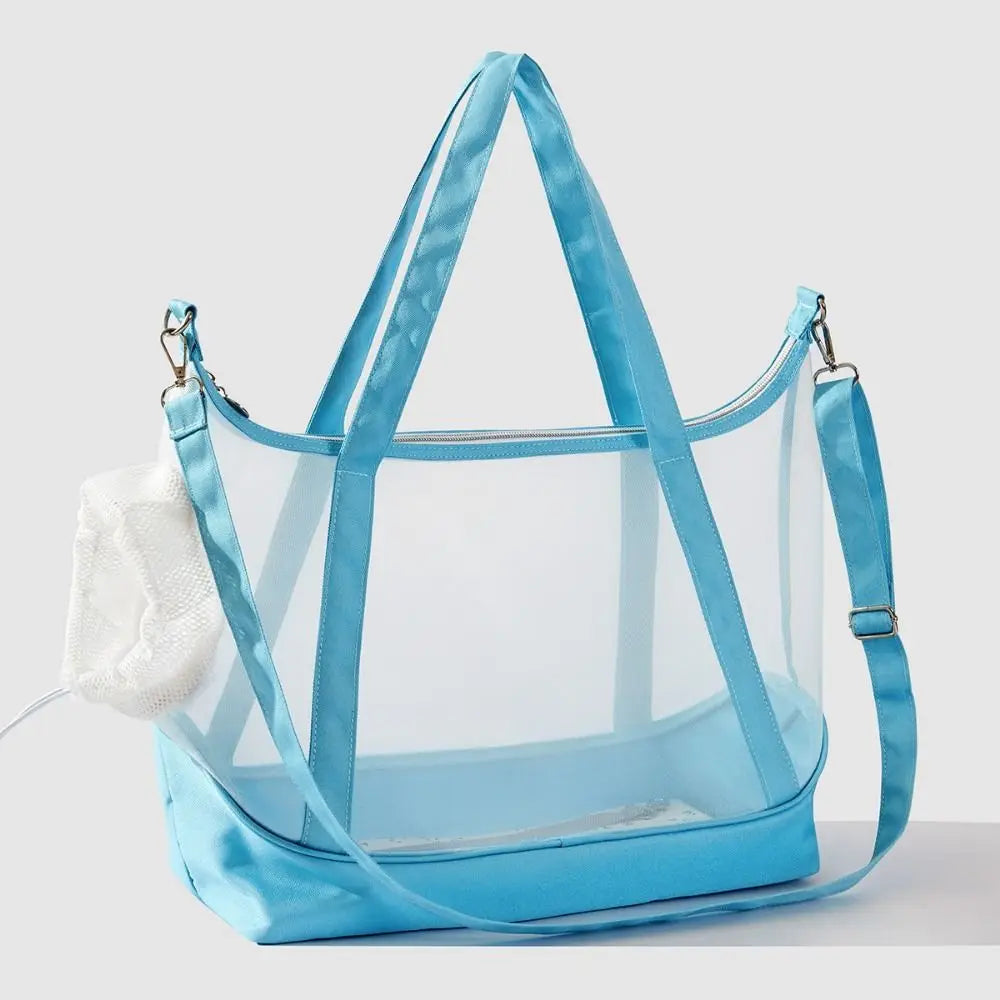 Sac de transport transparent pour chat bleu turquoise type tote bag avec vue panoramique, comprenant de grandes anses, une bandoulière d'épaule réglable et un filet de protection blanc.