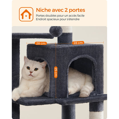 Infographie de démonstration de sécurité pour l'arbre à chat multi-niveaux de la marque Les Trésors d'Owka. L'image met en avant un chat roux en plein saut vers les plateformes grises, soulignant la stabilité exceptionnelle de la structure. Un zoom montre le kit anti-basculement inclus permettant de fixer solidement l'arbre pour chat au mur pour une protection totale dans votre maison. Cet arbre chat robuste est conçu pour supporter les mouvements brusques et les bonds énergiques des félins les plus actifs 