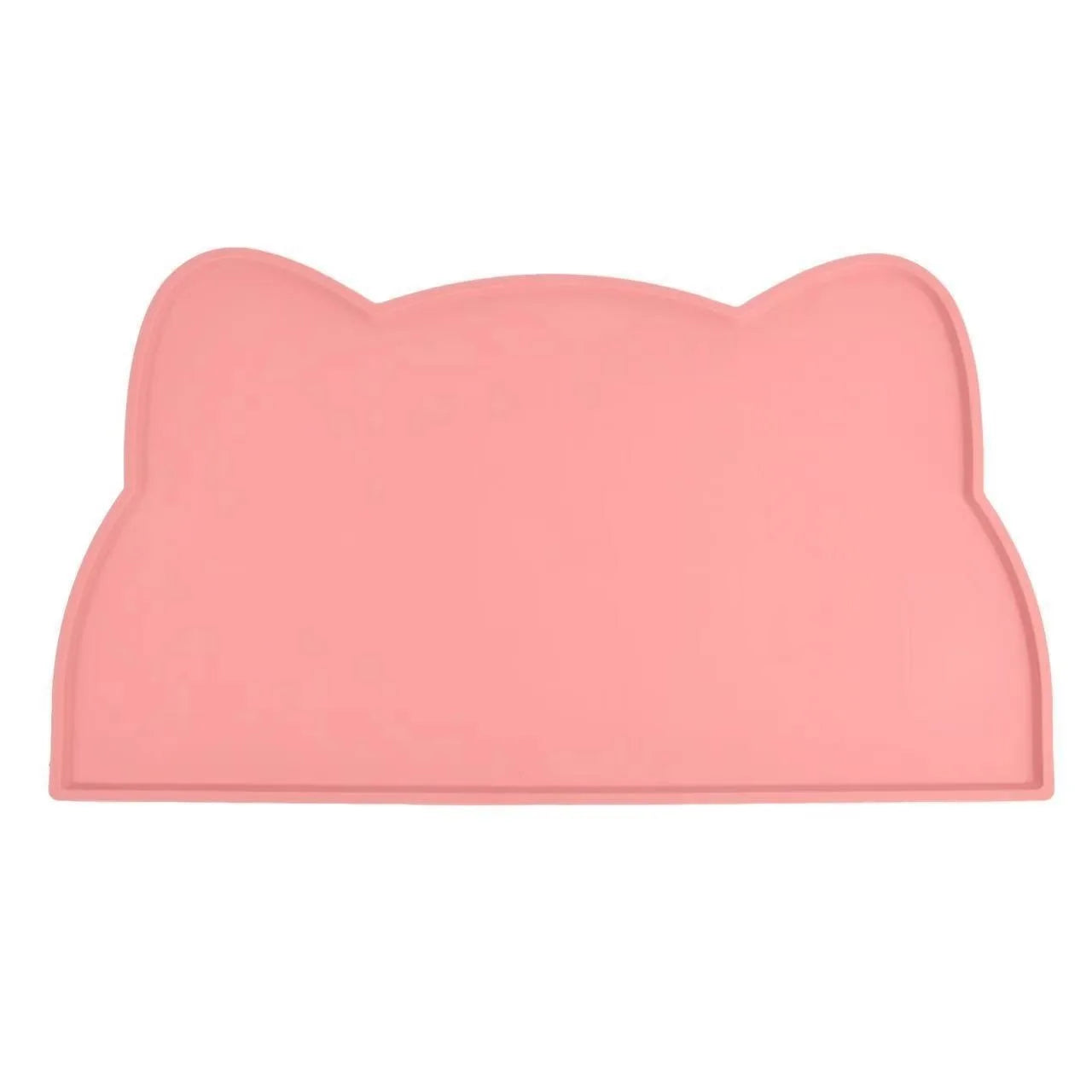 Photographie de face sur fond blanc du tapis gamelles chat en silicone rose poudré de la marque Les Trésors d'Owka. Ce tapis chat arbore un design élégant en forme de tête de félin avec des rebords surélevés anti-débordement pour contenir les projections d'eau et de nourriture. Fabriqué en silicone alimentaire de haute qualité, ce tapis gamelles est totalement imperméable, antidérapant et conçu pour protéger vos sols avec style. Sa finition mate et son coloris pastel en font l'accessoire d'hygiène idéal pou
